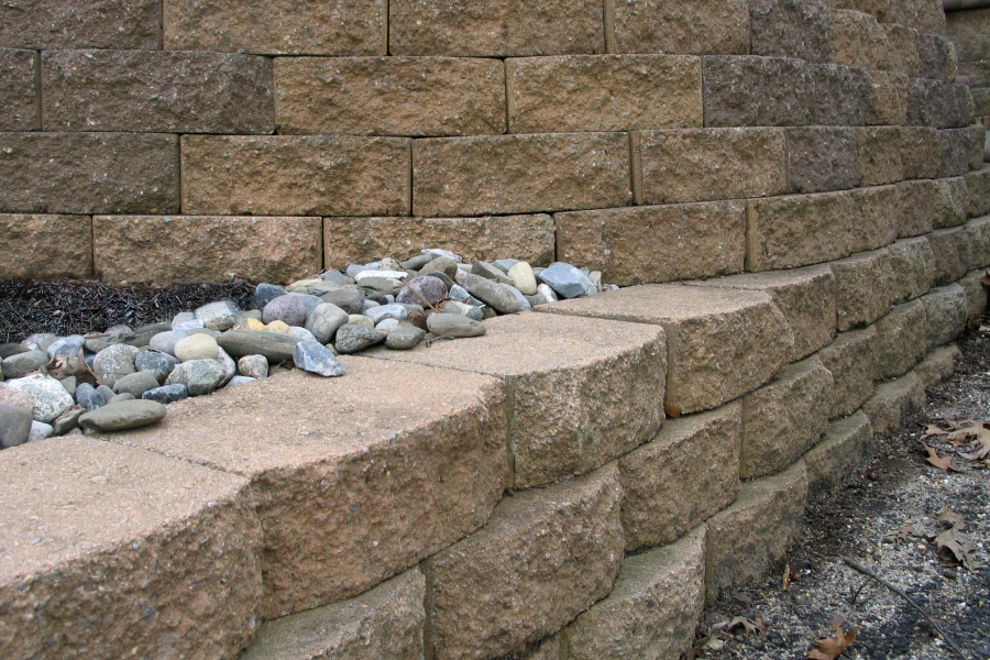 retaining bricked wall with some stones on top